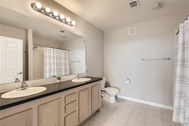 bathroom featuring vanity, tile patterned flooring, toilet, and a shower with shower curtain