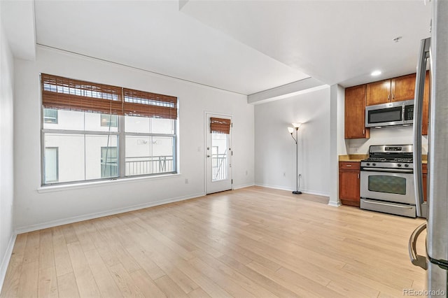 kitchen featuring light hardwood / wood-style flooring and stainless steel appliances