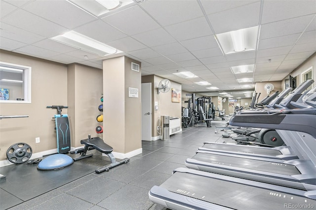 workout area with a drop ceiling