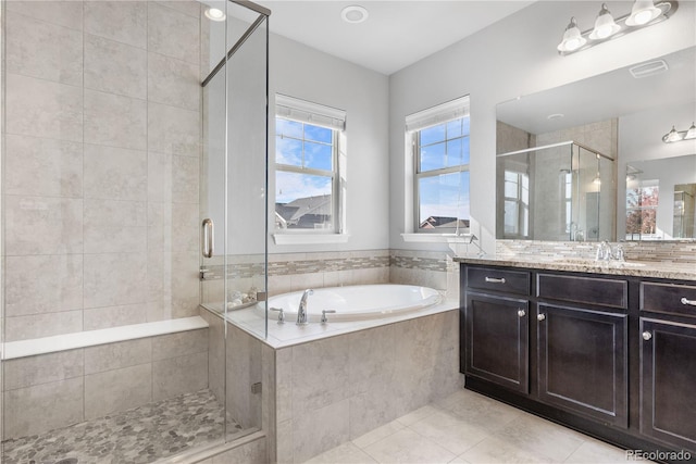 bathroom with vanity, separate shower and tub, and tile patterned flooring