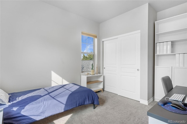 carpeted bedroom featuring a closet