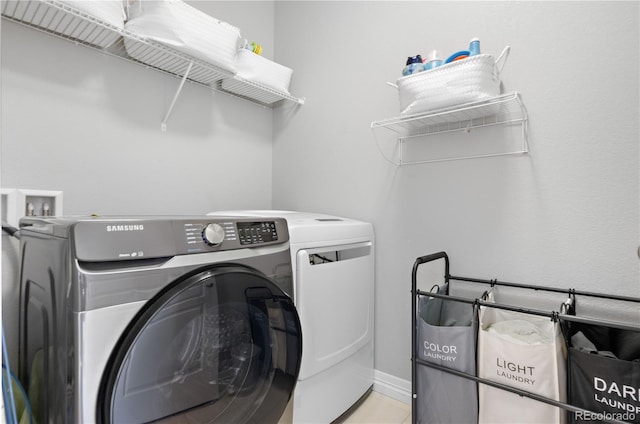 clothes washing area featuring washing machine and clothes dryer