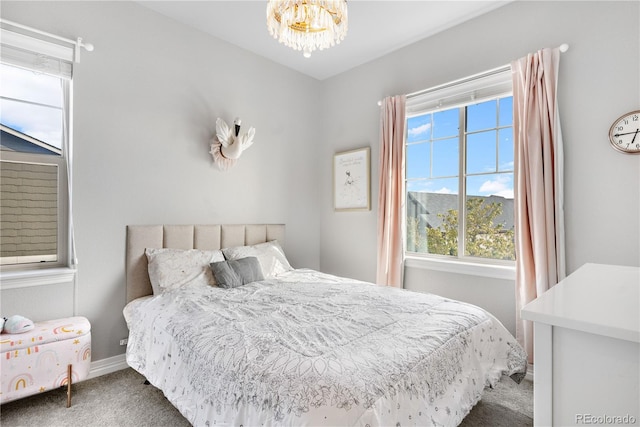 carpeted bedroom featuring multiple windows