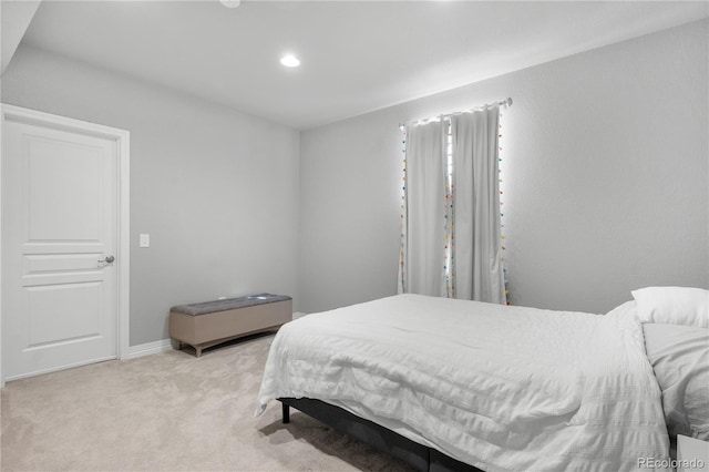 bedroom featuring light colored carpet