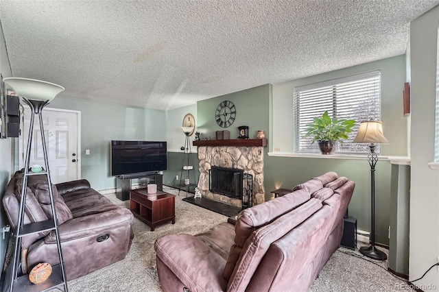 carpeted living room with a stone fireplace and a textured ceiling