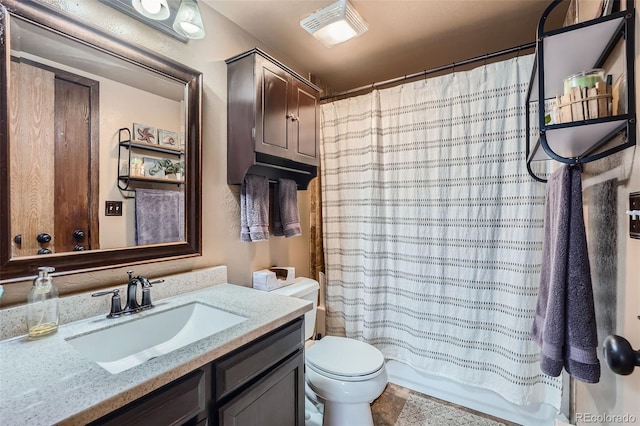 full bathroom featuring vanity, toilet, and shower / bath combo with shower curtain