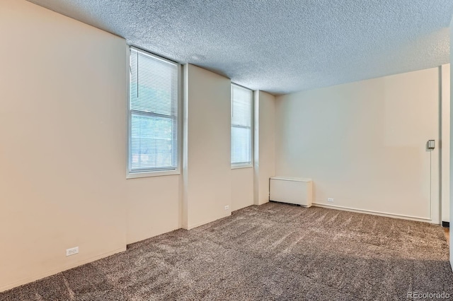 2225 Buchtel Blvd Unit 105, Denver, CO 80210 - carpeted spare room with a textured ceiling