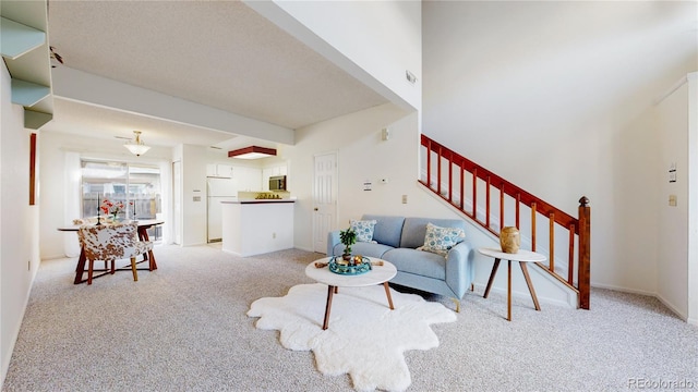 living room featuring light carpet