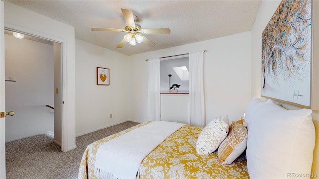 bedroom featuring carpet, a textured ceiling, and ceiling fan