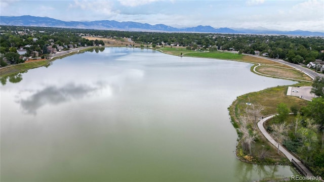 birds eye view of property featuring a water and mountain view