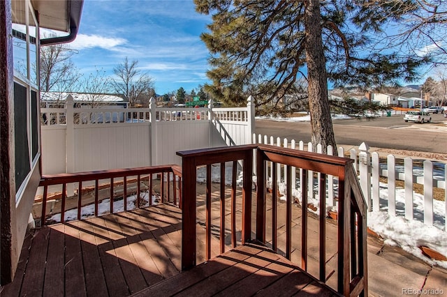 wooden deck featuring fence