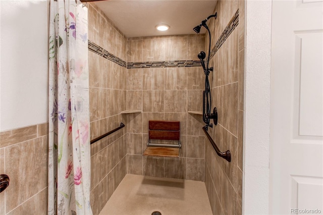 full bath with tiled shower