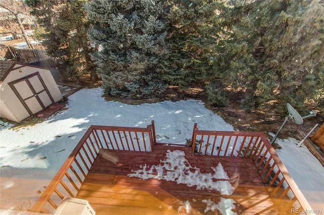 deck featuring an outbuilding and a storage unit