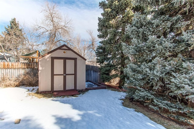 view of shed with a fenced backyard