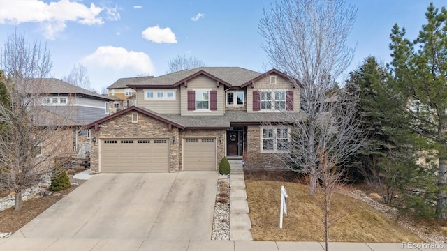 craftsman inspired home with a garage, stone siding, driveway, and a shingled roof