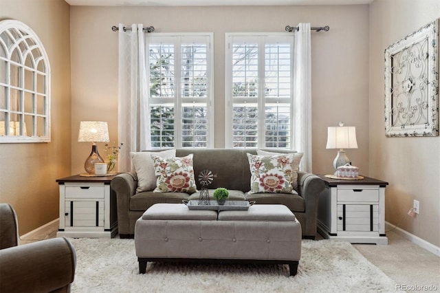 living room with carpet and baseboards