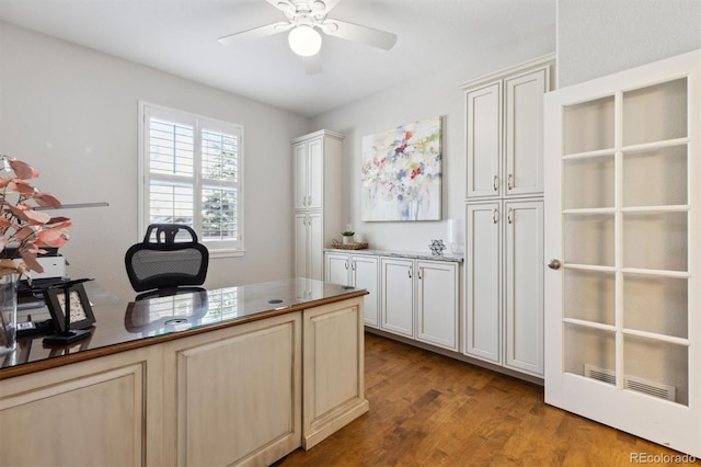 home office with ceiling fan and wood finished floors