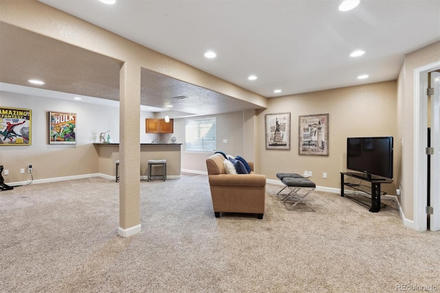 living room featuring light carpet, baseboards, and recessed lighting