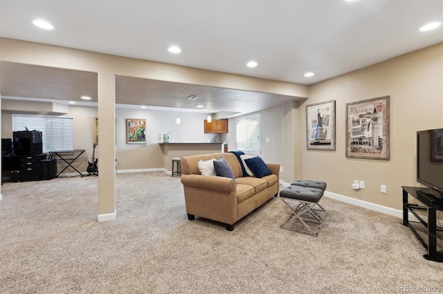 living room with baseboards, recessed lighting, and light colored carpet