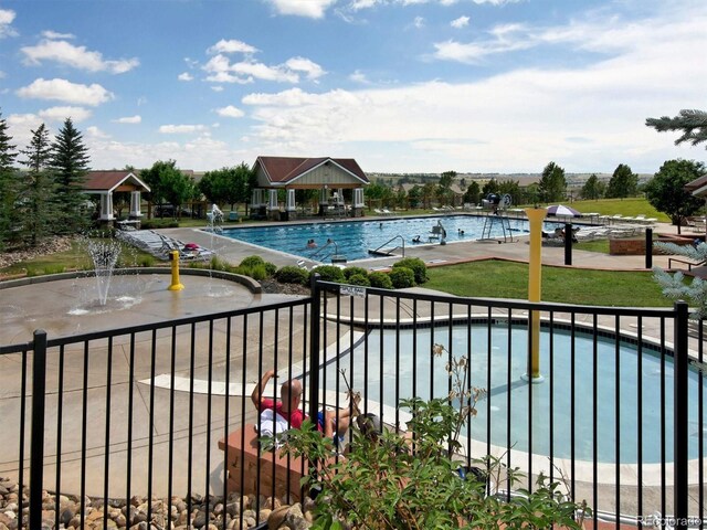 pool featuring a gazebo and a patio area