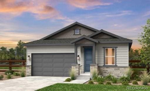 16975 W 92nd Loop, Arvada, CO 80007 - view of front of home with concrete driveway, a garage, and stone siding