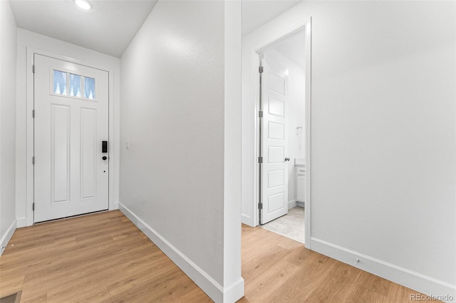 16975 W 92nd Loop, Arvada, CO 80007 - entrance foyer featuring light wood-style floors and baseboards
