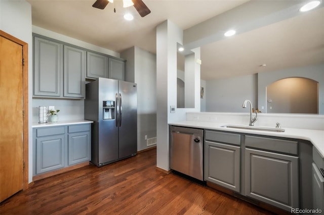 4197 Purple Plum Way, Colorado Springs, CO 80920 - kitchen with stainless steel appliances, a sink, gray cabinets, ceiling fan, and dark wood finished floors