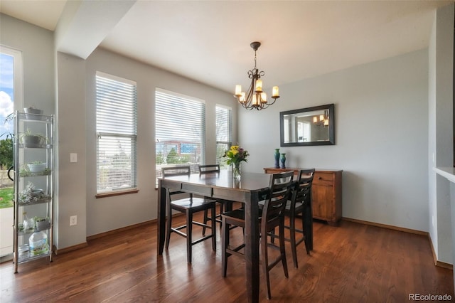 4197 Purple Plum Way, Colorado Springs, CO 80920 - dining space with a chandelier, dark wood-style floors, and baseboards