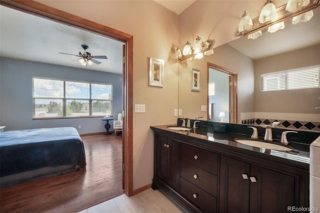 4197 Purple Plum Way, Colorado Springs, CO 80920 - full bath with healthy amount of natural light, a ceiling fan, double vanity, and baseboards