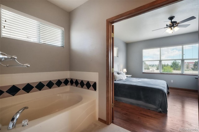 4197 Purple Plum Way, Colorado Springs, CO 80920 - full bath with a garden tub, ceiling fan, wood finished floors, and connected bathroom