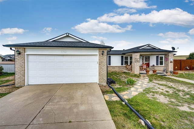 652 Dakota St, Kiowa, CO 80117 - single story home featuring concrete driveway, brick siding, fence, a shingled roof, and a garage