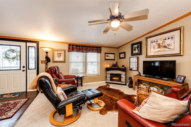 652 Dakota St, Kiowa, CO 80117 - living room featuring vaulted ceiling, crown molding, a ceiling fan, and a fireplace