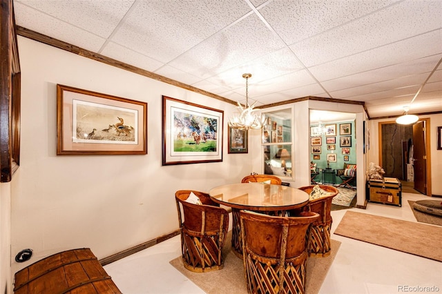 652 Dakota St, Kiowa, CO 80117 - dining room featuring a paneled ceiling and crown molding