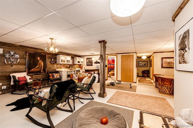 652 Dakota St, Kiowa, CO 80117 - living area with wooden walls, a paneled ceiling, and a chandelier