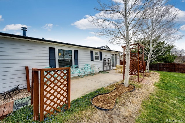 652 Dakota St, Kiowa, CO 80117 - rear view of property with a patio area