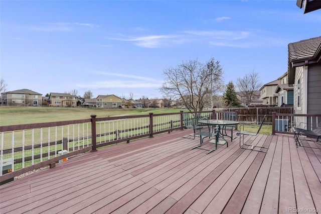 deck featuring a yard and a residential view