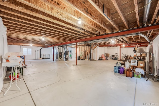 basement with water heater and stairs