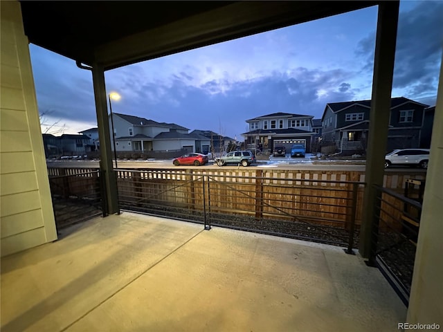 patio terrace at dusk with a balcony