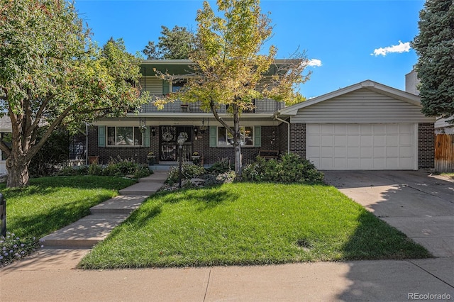 7622 E Nassau Ave, Denver, CO 80237 - view of front of home with brick siding, a garage, driveway, a front yard, and a balcony