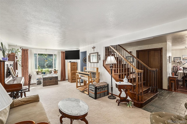7622 E Nassau Ave, Denver, CO 80237 - living room featuring a textured ceiling, stairway, and carpet flooring