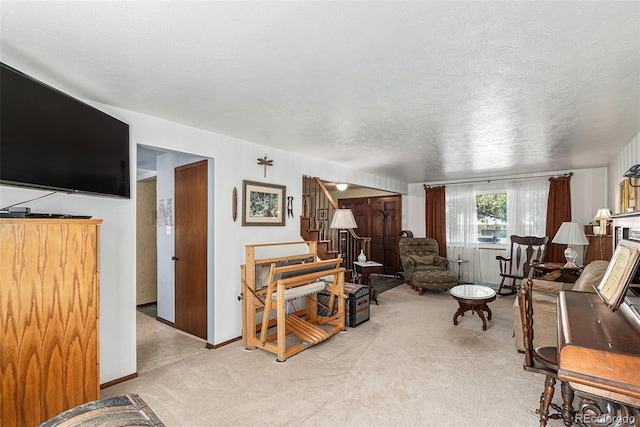 7622 E Nassau Ave, Denver, CO 80237 - living room with light colored carpet, stairway, and a textured ceiling