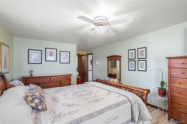 7622 E Nassau Ave, Denver, CO 80237 - bedroom featuring light wood finished floors and ceiling fan