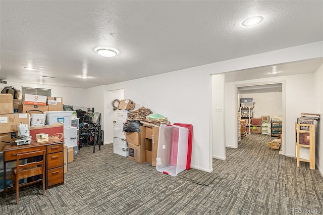 7622 E Nassau Ave, Denver, CO 80237 - below grade area featuring a textured ceiling and carpet flooring