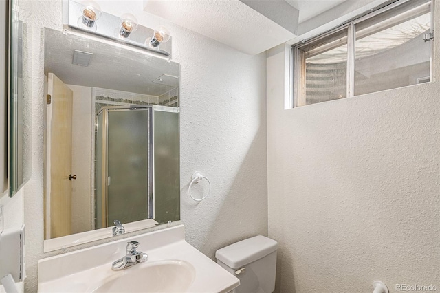 7622 E Nassau Ave, Denver, CO 80237 - full bathroom with a textured wall, vanity, and a stall shower