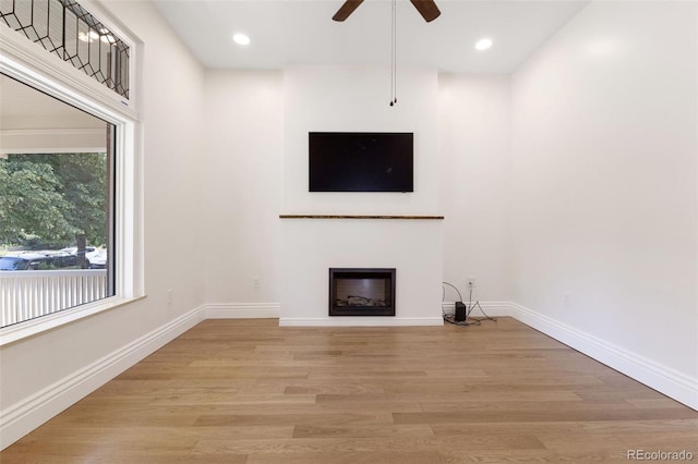 459 N Clarkson St, Denver, CO 80218 - unfurnished living room featuring a fireplace, light wood-style floors, a ceiling fan, and recessed lighting