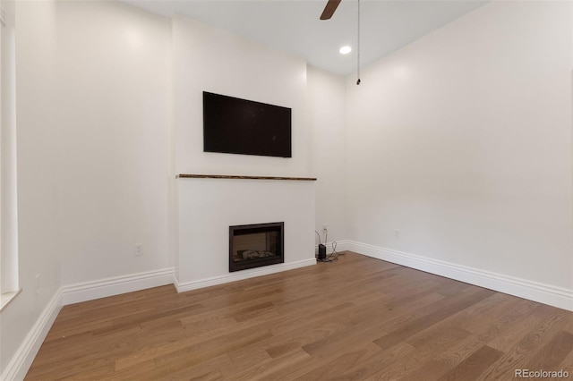 459 N Clarkson St, Denver, CO 80218 - unfurnished living room featuring wood finished floors, a fireplace, and a ceiling fan