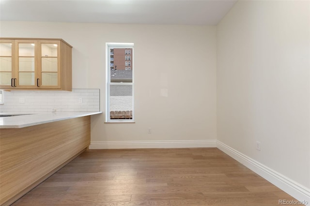 459 N Clarkson St, Denver, CO 80218 - unfurnished dining area with light wood finished floors and baseboards