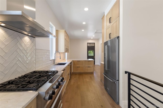 459 N Clarkson St, Denver, CO 80218 - kitchen with high end refrigerator, wall chimney range hood, light brown cabinets, cooktop, and recessed lighting
