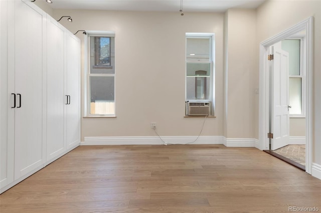 459 N Clarkson St, Denver, CO 80218 - unfurnished bedroom with cooling unit and light wood-type flooring