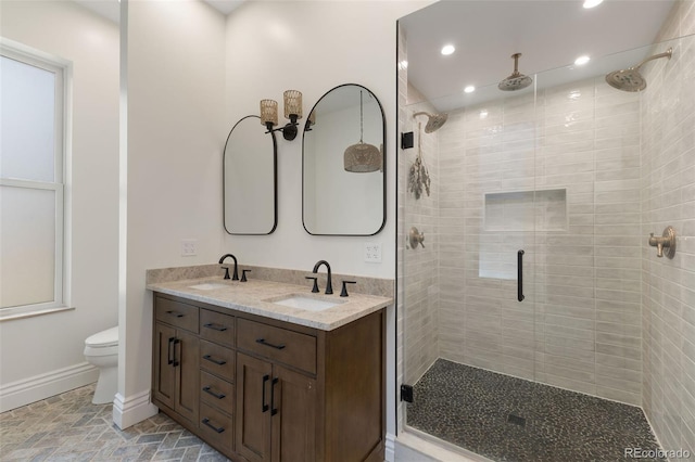 459 N Clarkson St, Denver, CO 80218 - full bath with a stall shower, recessed lighting, double vanity, and stone finish flooring